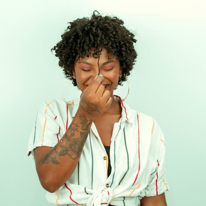 Woman with Short and Curly Hair Smiling 